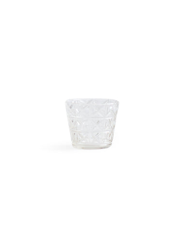Silhouetted mini choko cut glass in crystal pattern against white background.