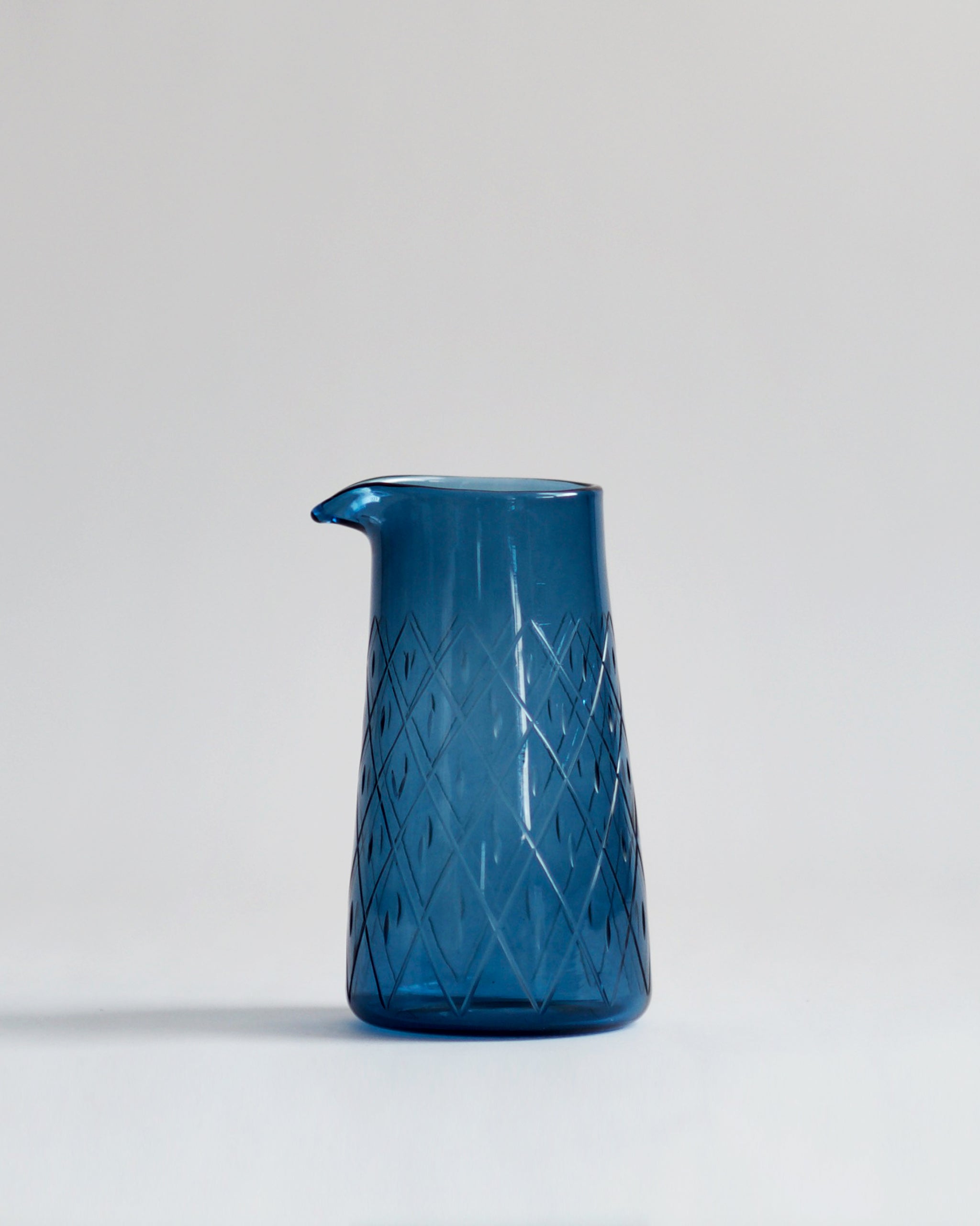 Wire net one lipped pitcher in dark blue.