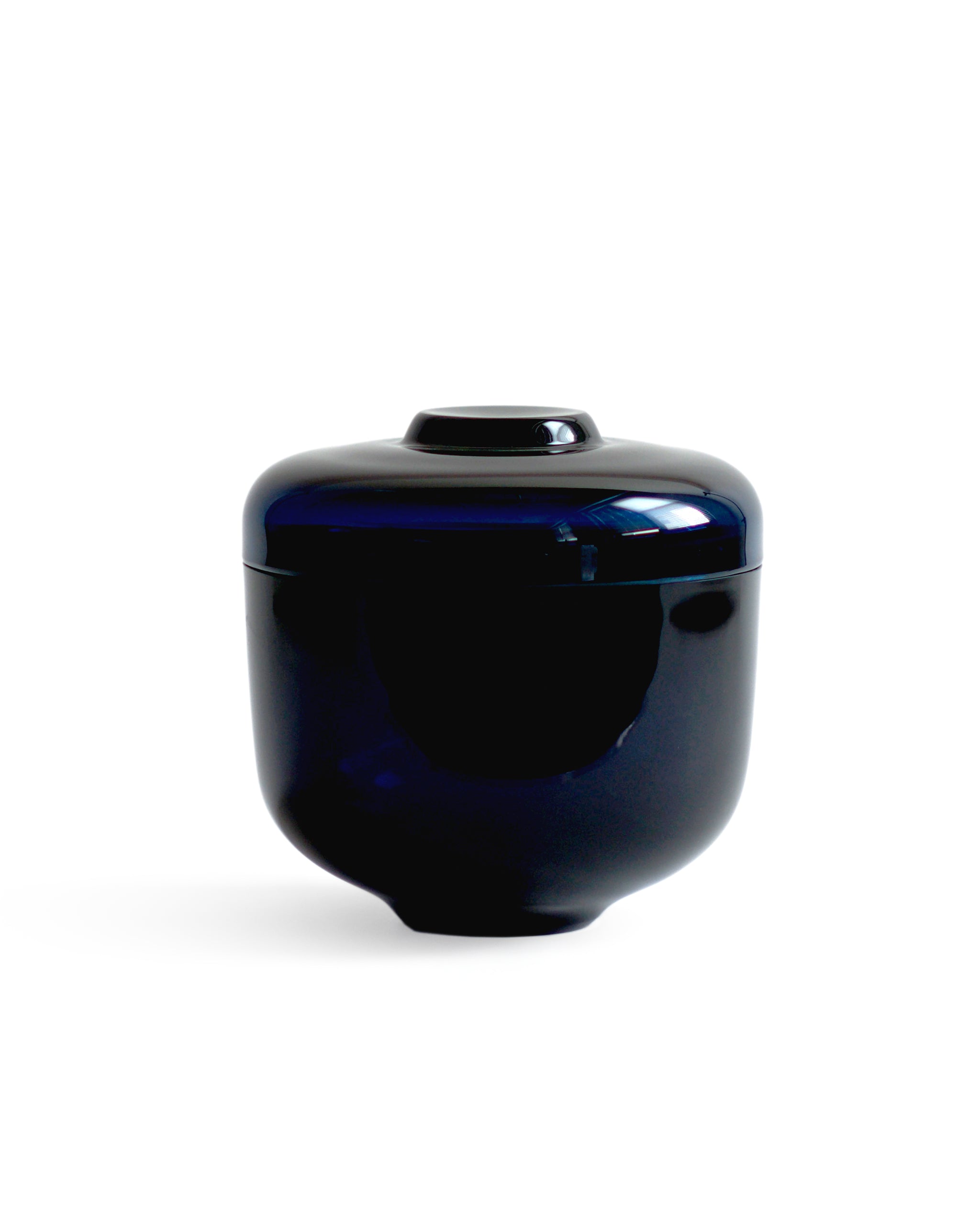 Silhouetted reclaimed blue homage lee dynasty container against white background.