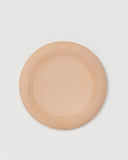 Top view of Flying Disc by Hender Scheme on a gray background