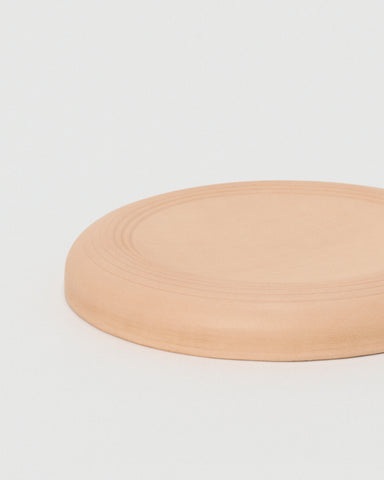 Flying Disc by Hender Scheme on a gray background
