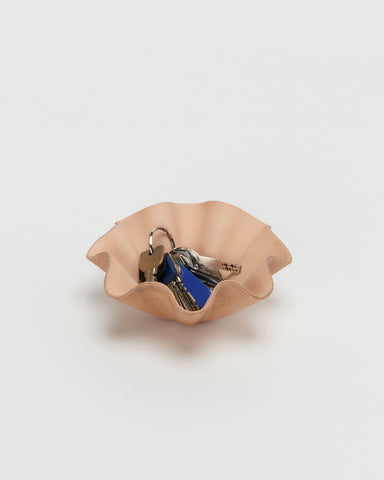 Leather Shell Bowl by Hender Scheme in small  with keys in bowl on a gray  background