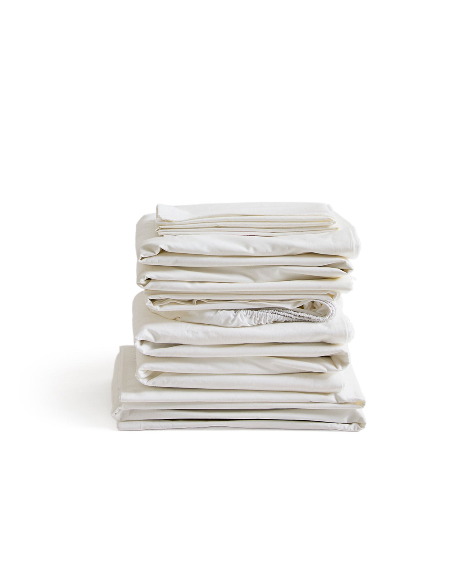 Stack of white folded sheets by Iwata on a white background