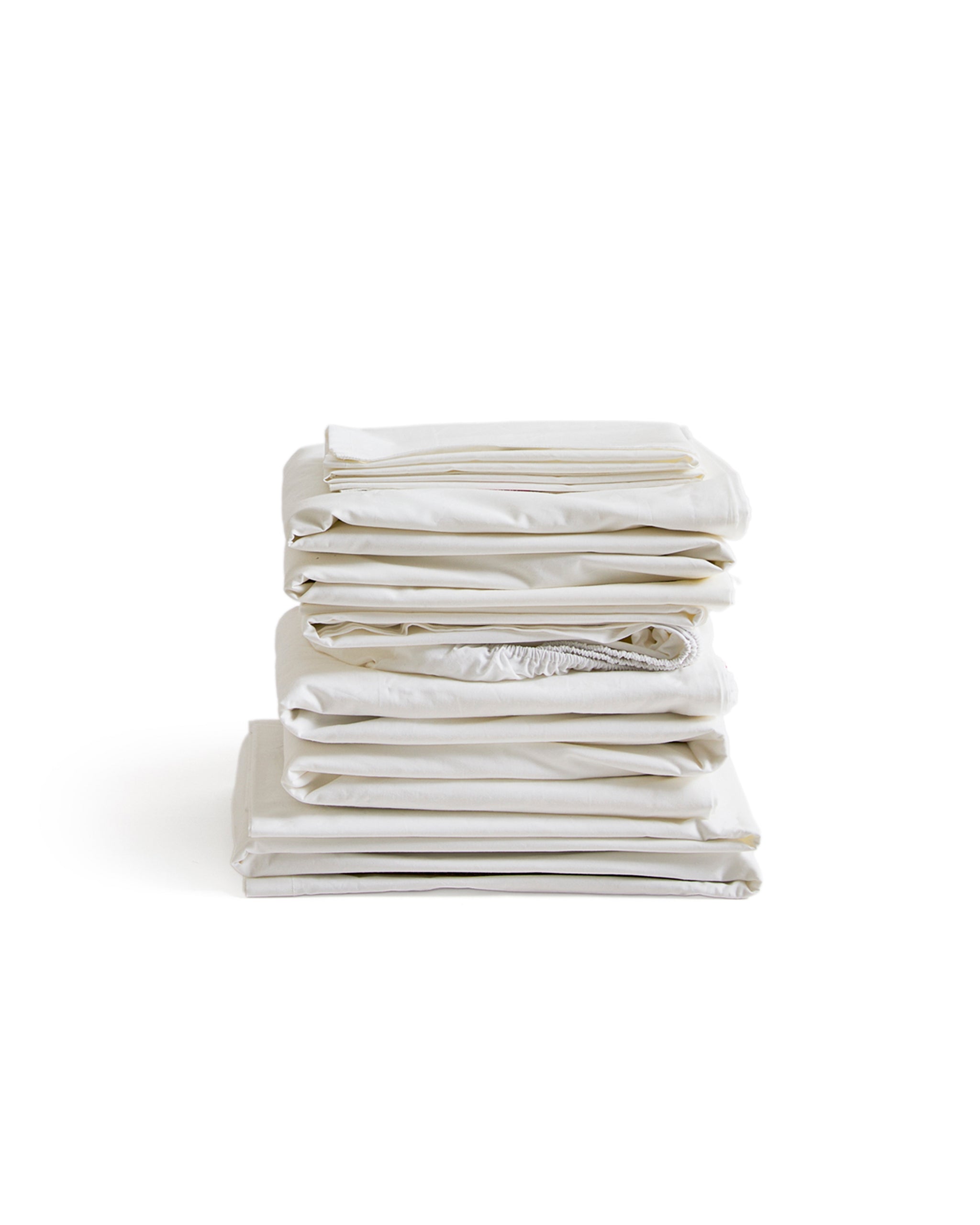 Stack of white folded sheets by Iwata on a white background