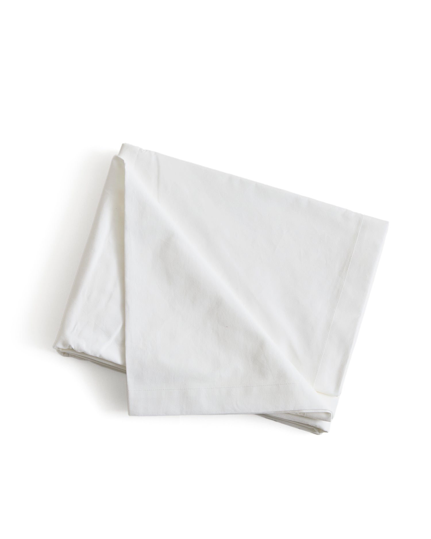 White folded flat sheet by Iwata on a white background