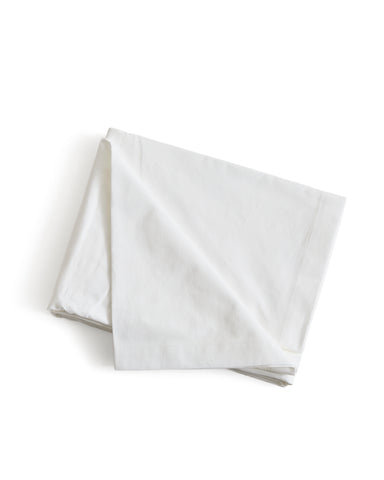 White folded flat sheet by Iwata on a white background