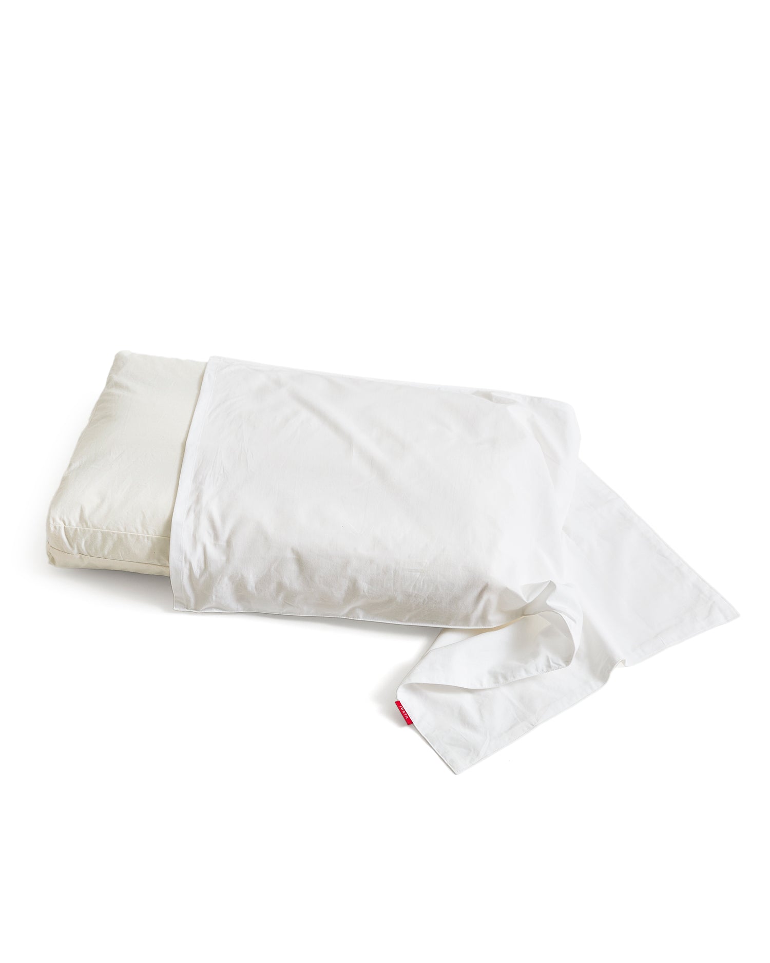 White pillow with white pillow sheet by Iwata on a white background