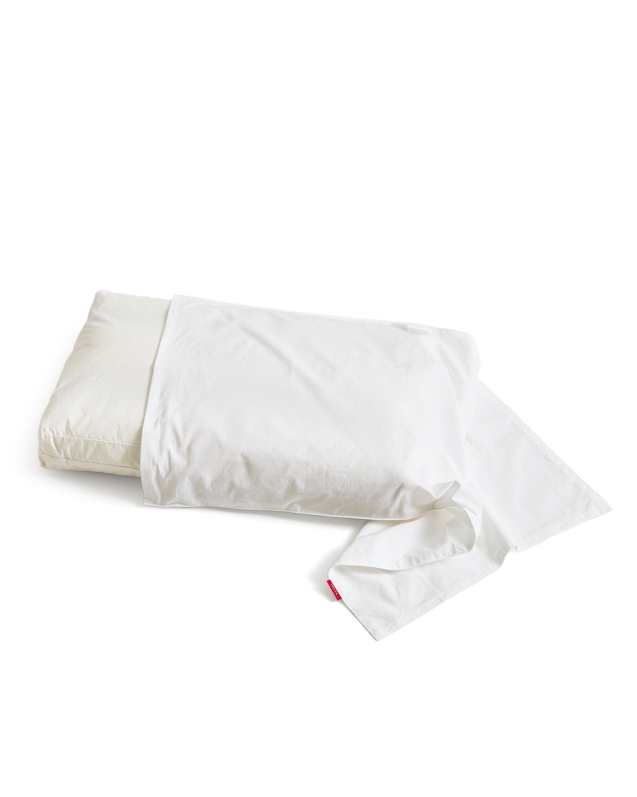 White pillow with white pillow sheet by Iwata on a white background