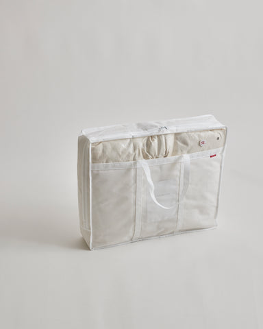 Storage bag for Light Duvet by Iwata on a gray background