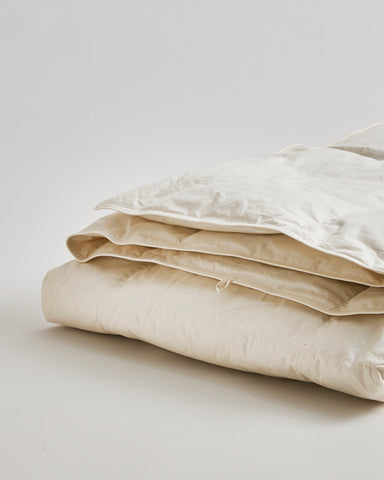 Up-close of Light Duvet by Iwata on a gray background