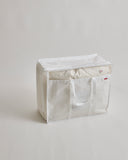 Duvet storage box with handles by Iwata on a light gray background