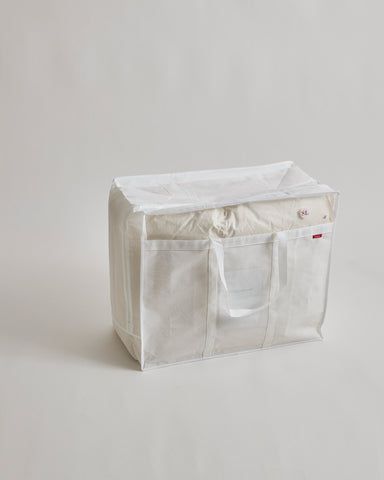 Duvet storage box with handles by Iwata on a light gray background