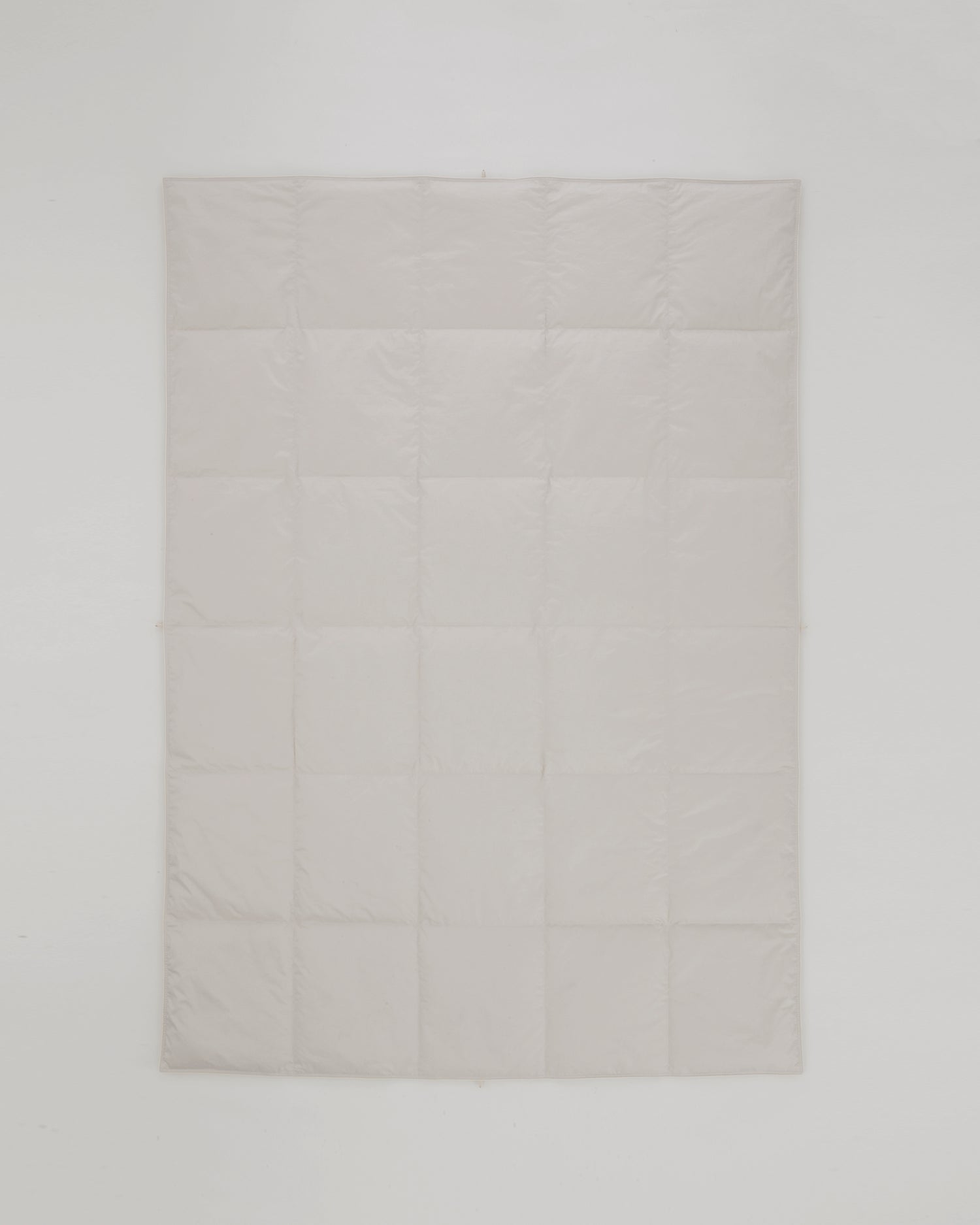 Flat view of Medium Duvet by Iwata on a gray background