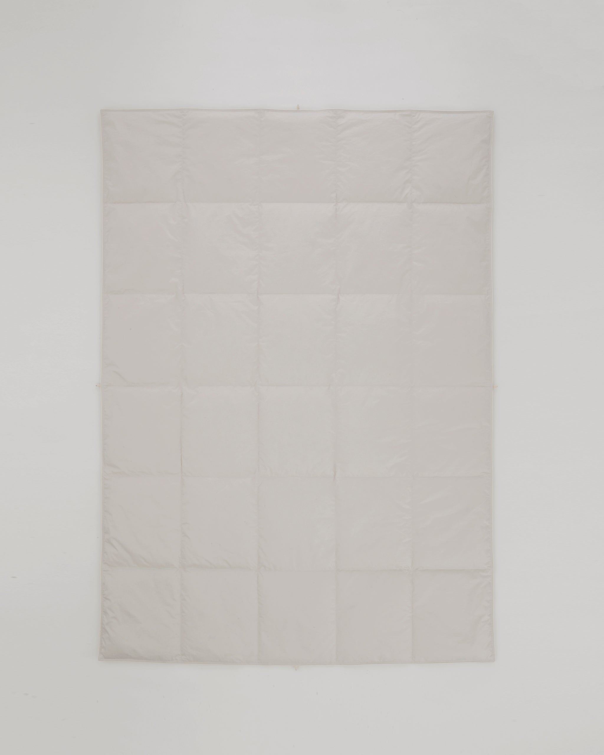 Flat view of Medium Duvet by Iwata on a gray background