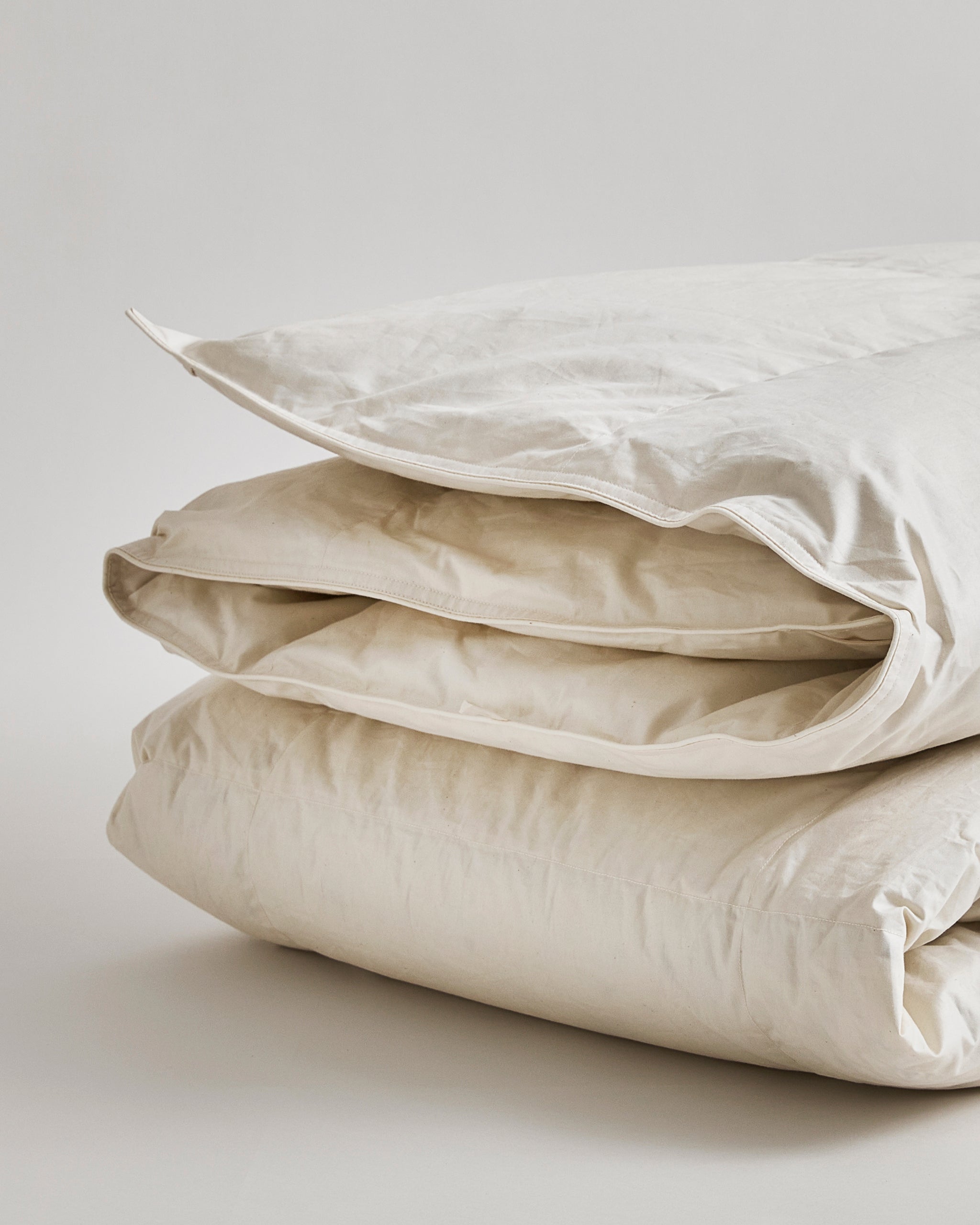 Up-close of Medium Duvet by Iwata on a white background