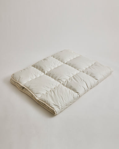 Camel Heavy Mattress Pad by Iwata on a gray background