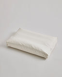 CAmel hair pillow by Iwata on a light gray background