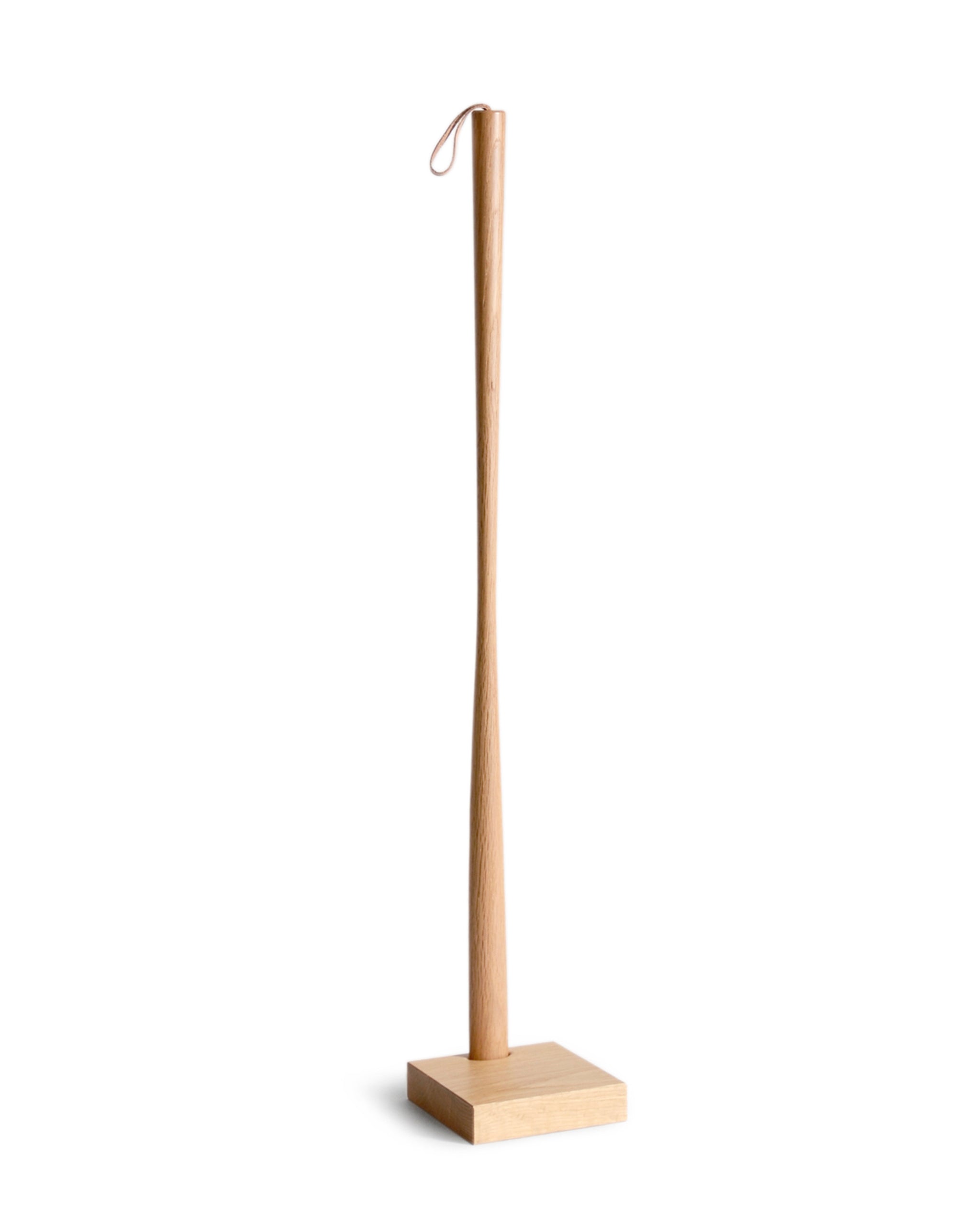 Wooden shoe horn with square base by Nalata Nalata and Kime on a white background