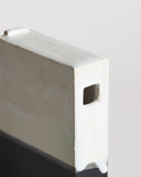 Up-close of Black and White Hanging Vase by Masanobu Ando on a gray background