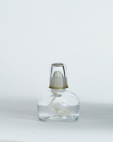 Front view of oil lamp that pairs with the ceramic teapot warmer with sterling silver overglaze by Masanobu Ando against white-gray background.