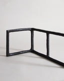 Up-close of Black Rust Glaze Boundary Sculpture by Masanobu Ando on a gray background
