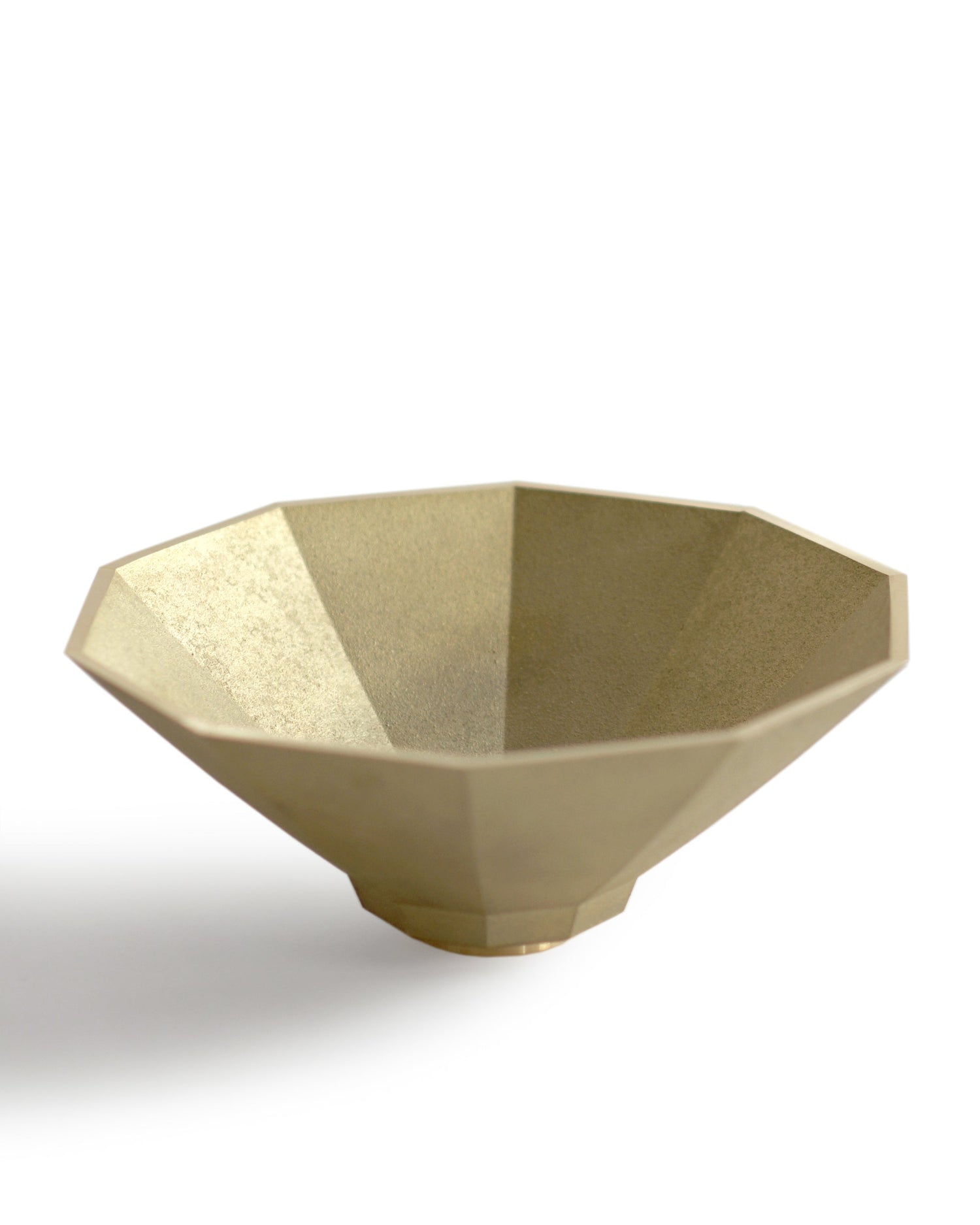 Silhouetted matureware wash bowl against white background.