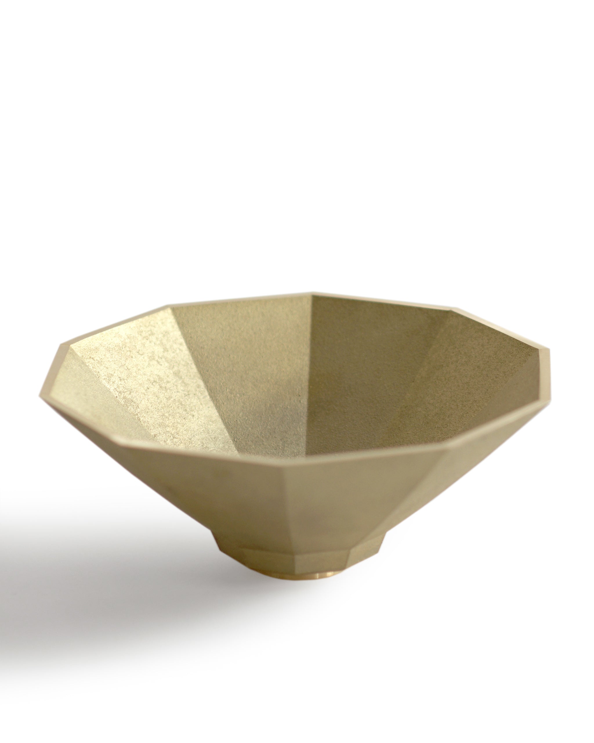Silhouetted matureware wash bowl against white background.