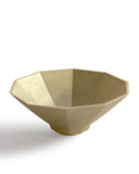 Silhouetted matureware wash bowl against white background.
