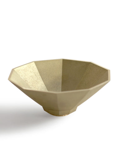 Silhouetted matureware wash bowl against white background.