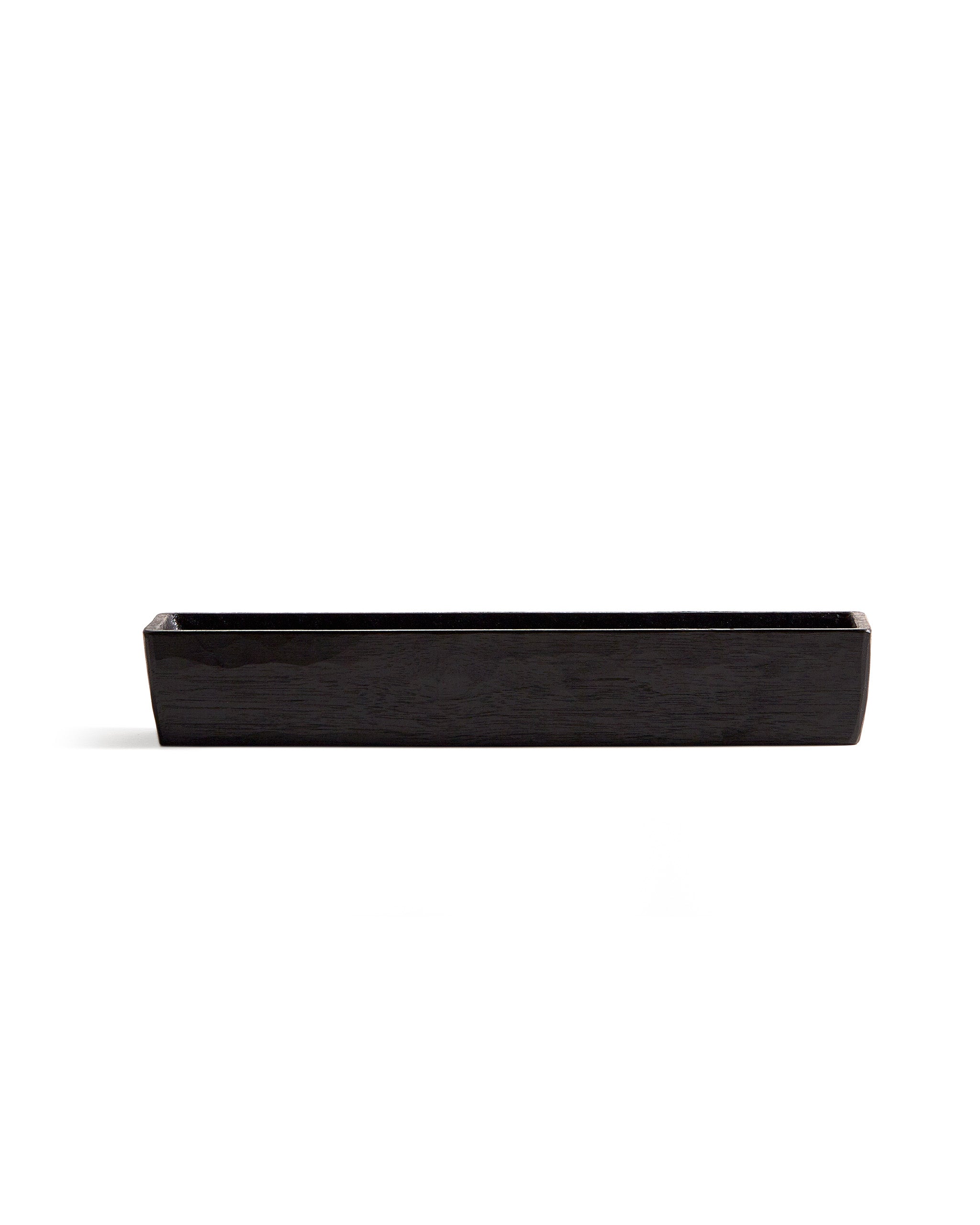 Silhouetted image of Chopsticks Holder by Ryuji Mitani against white background. 