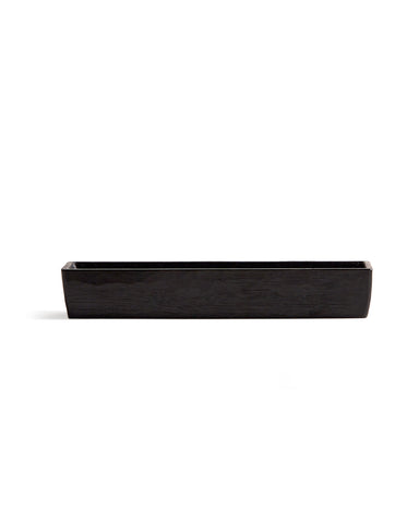 Silhouetted image of Chopsticks Holder by Ryuji Mitani against white background. 