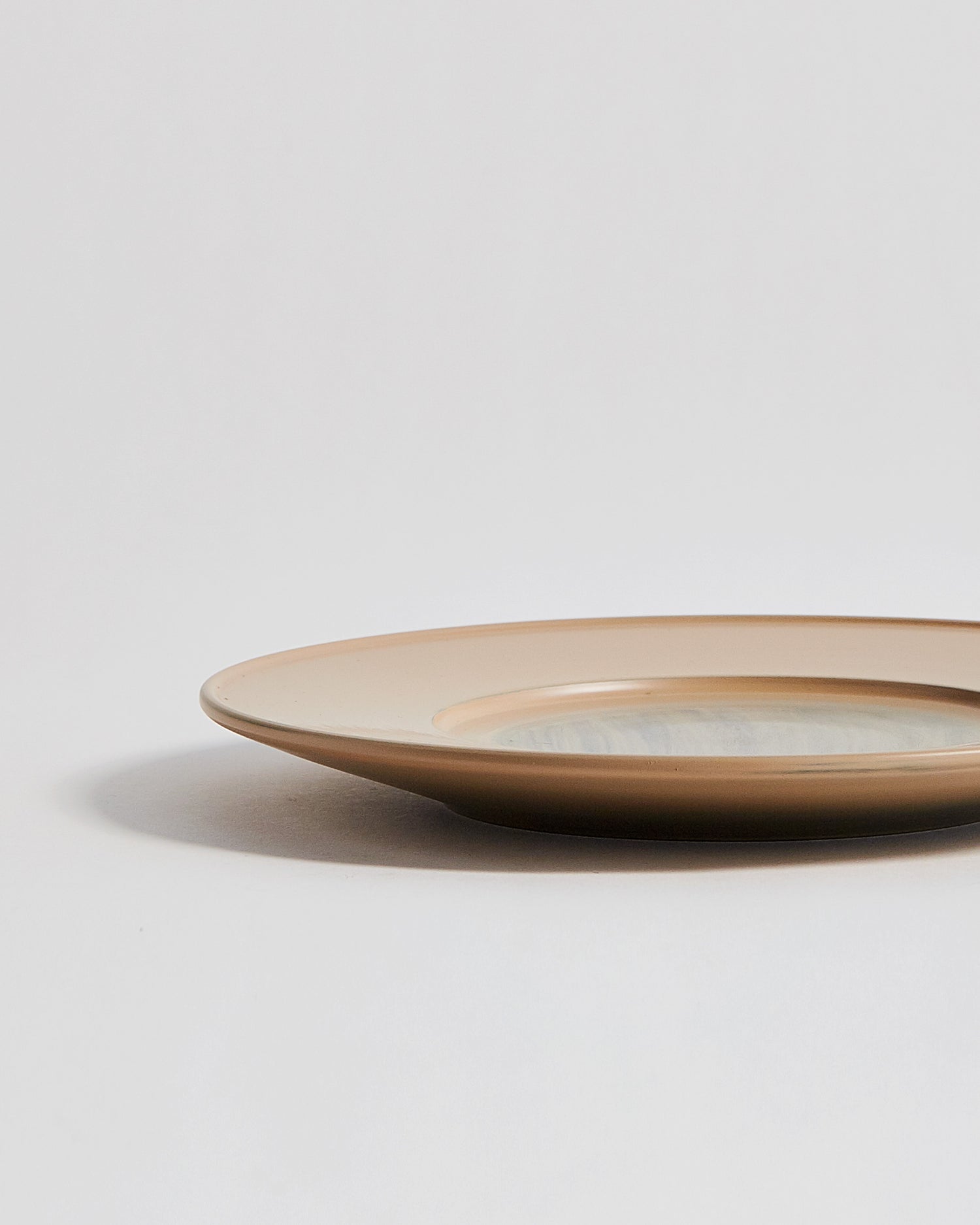 Cropped view of large White Urushi Plate by Ryuji Mitani against white-gray background. 