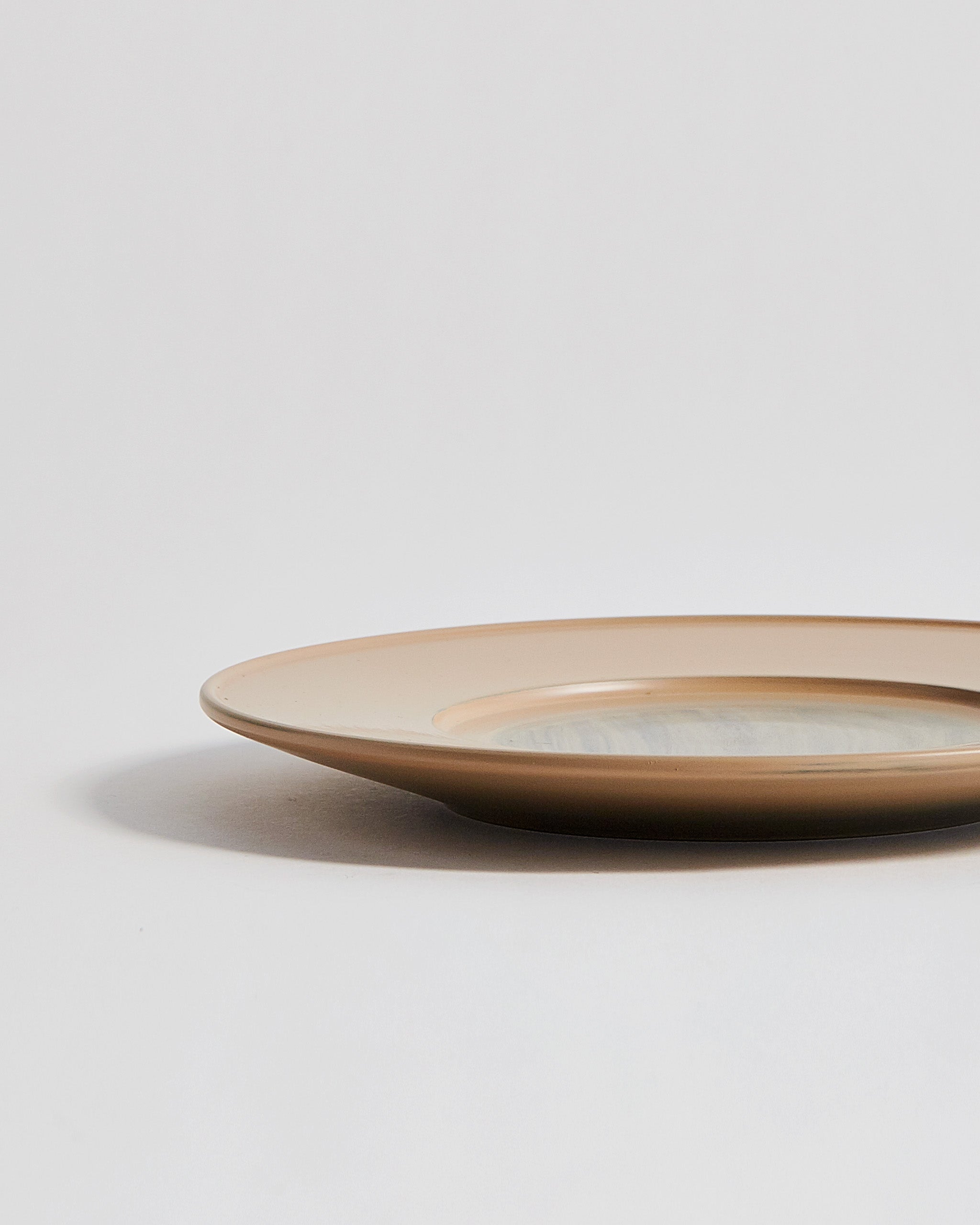 Cropped view of large White Urushi Plate by Ryuji Mitani against white-gray background. 