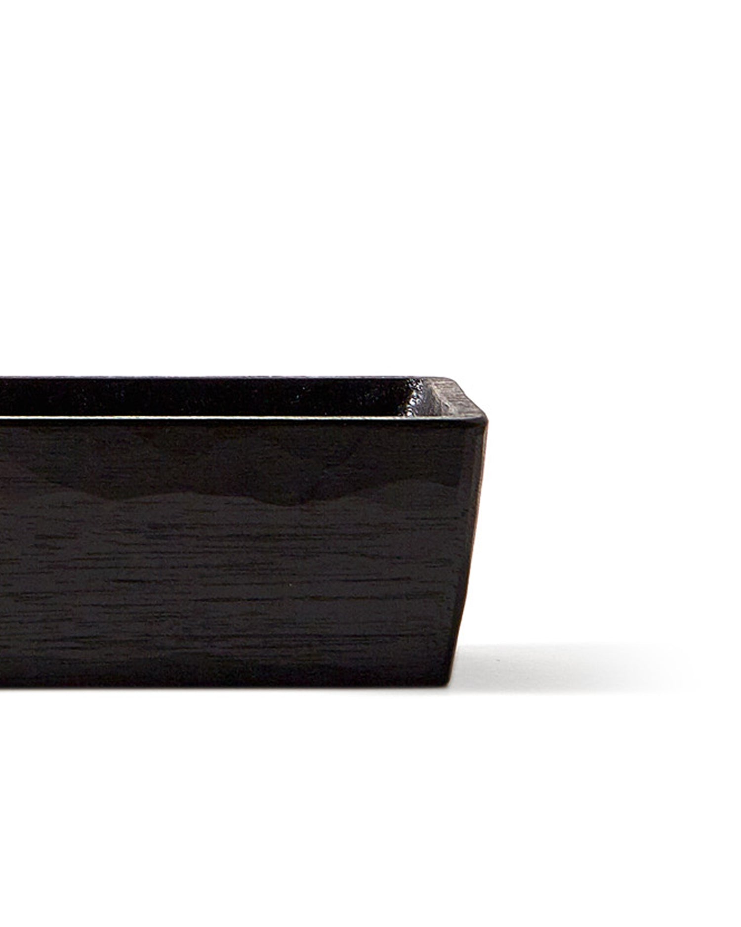 Silhouetted image of detail of Chopsticks Holder by Ryuji Mitani against white background.