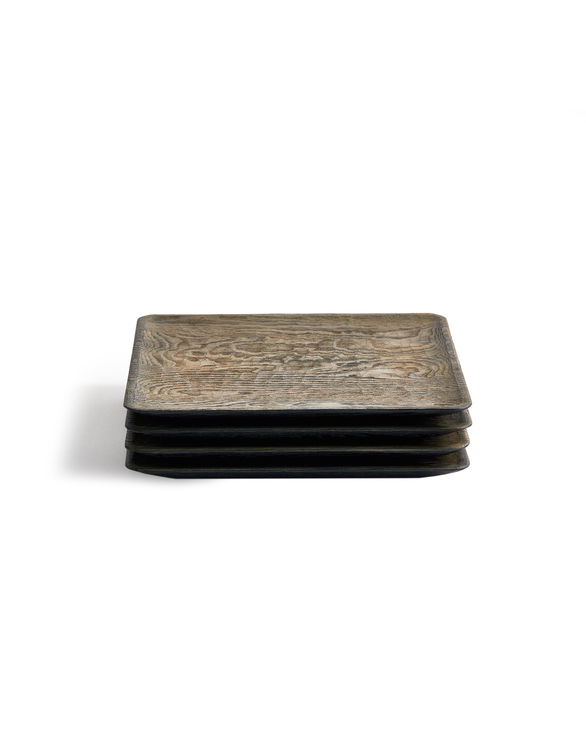 Front view of 4 stacked Usuzumi Square Plates with Chestnut Wood by Ryuji Mitani against white background.