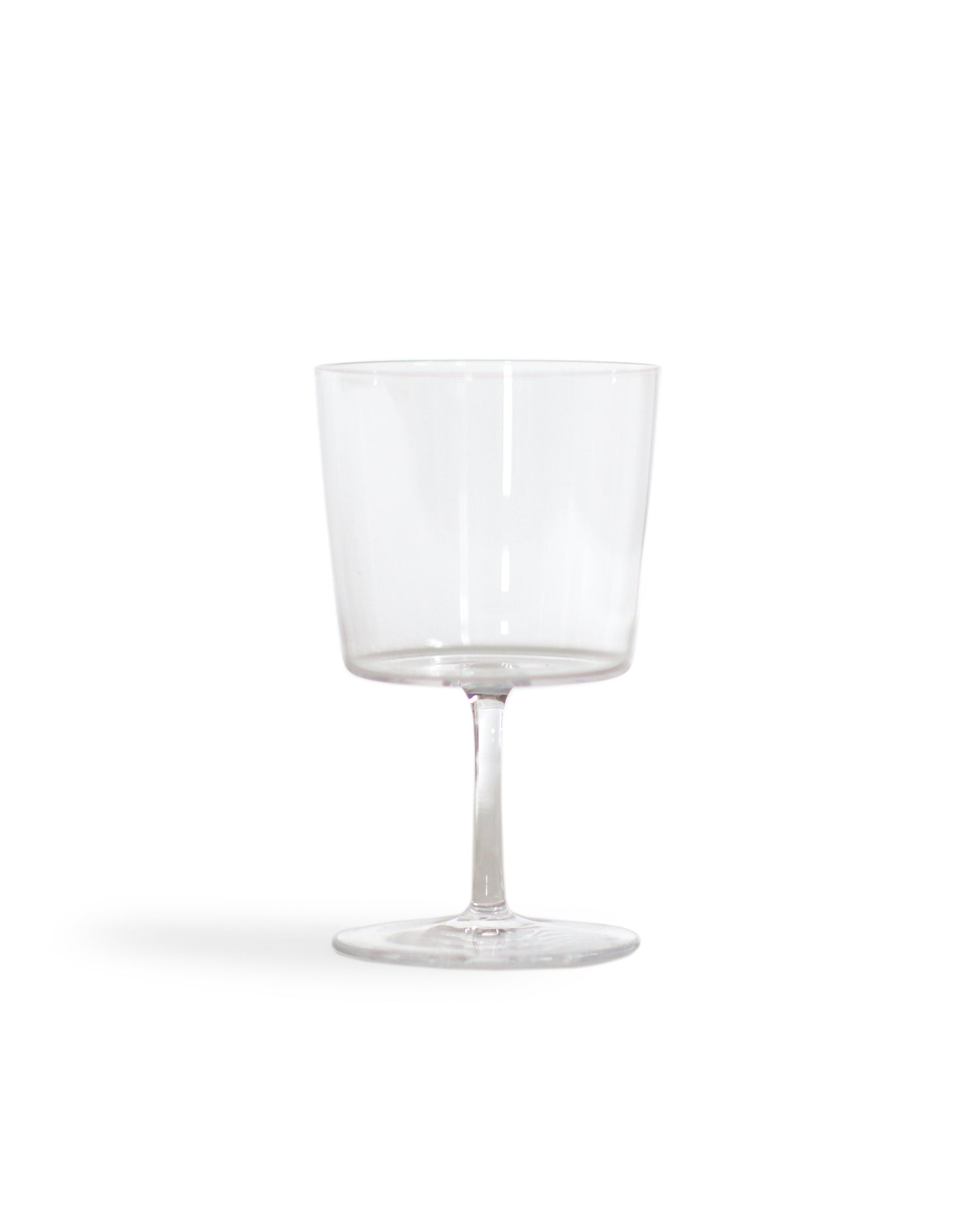 Silhouetted time and style raisin glass against white background.