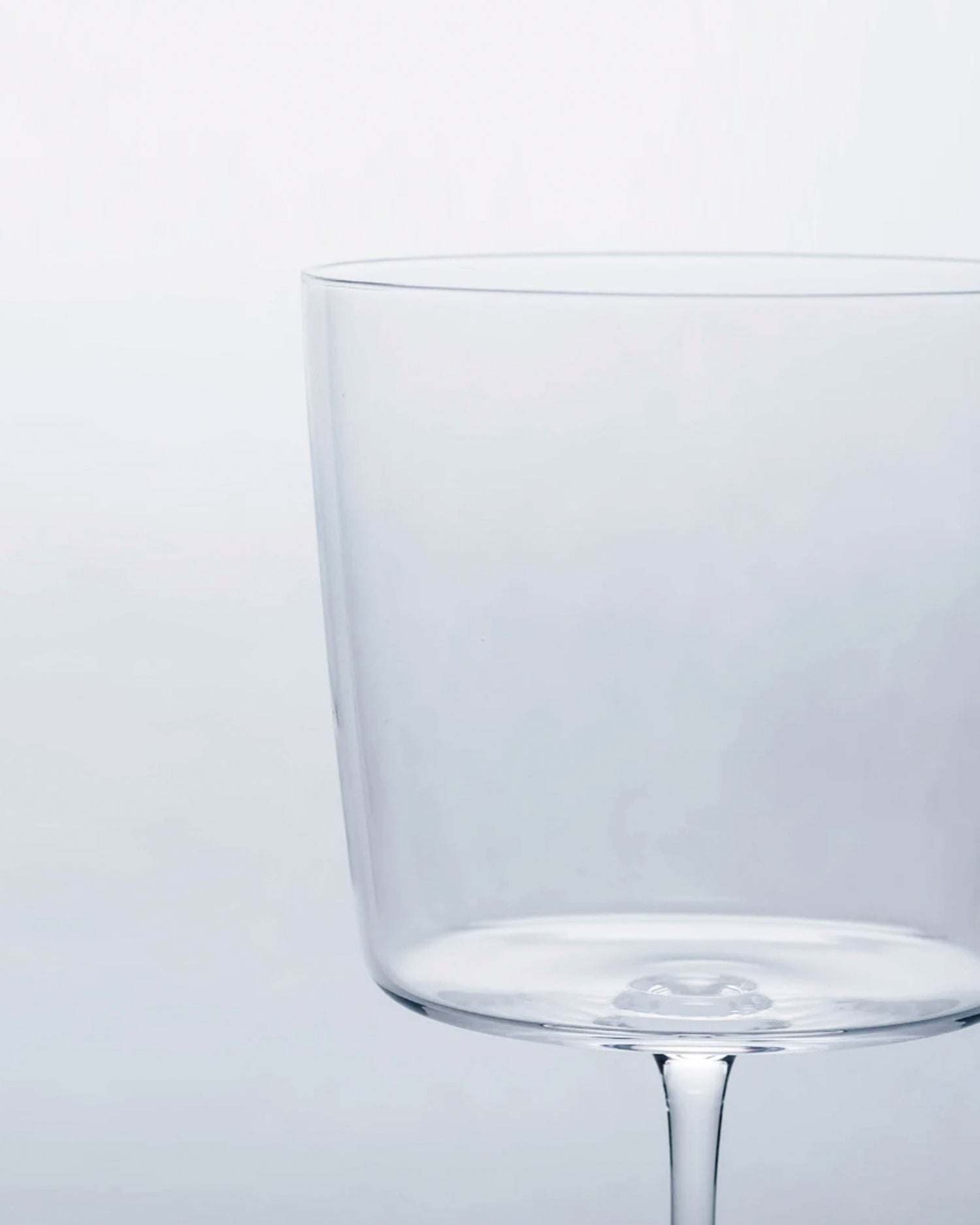 Cropped detail image of the time and style raisin glass focused on the top cup portion.