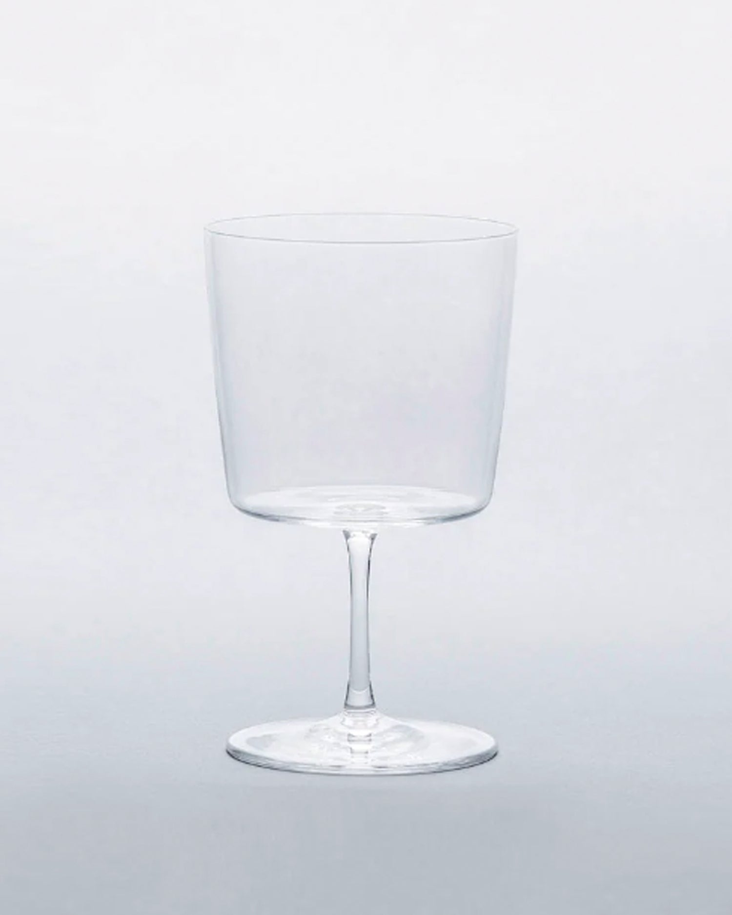 Time and style raisin glass against gray background.