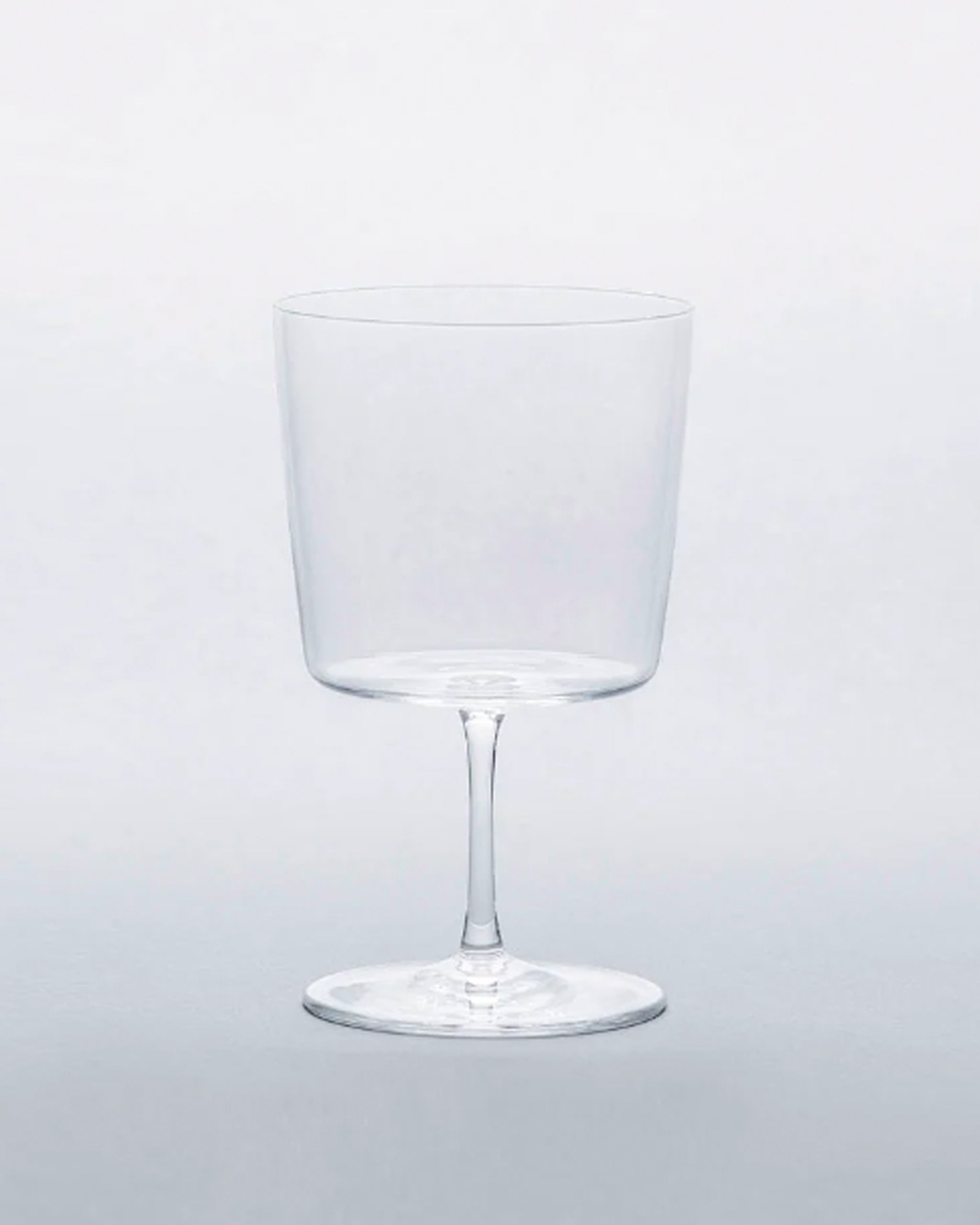 Time and style raisin glass against gray background.