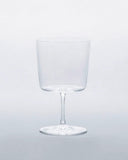 Time and style raisin glass against gray background.