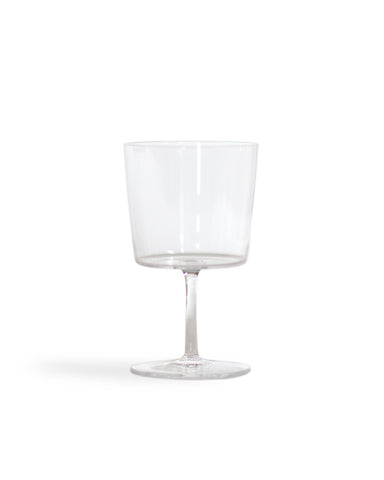 Silhouetted time and style raisin glass against white background.