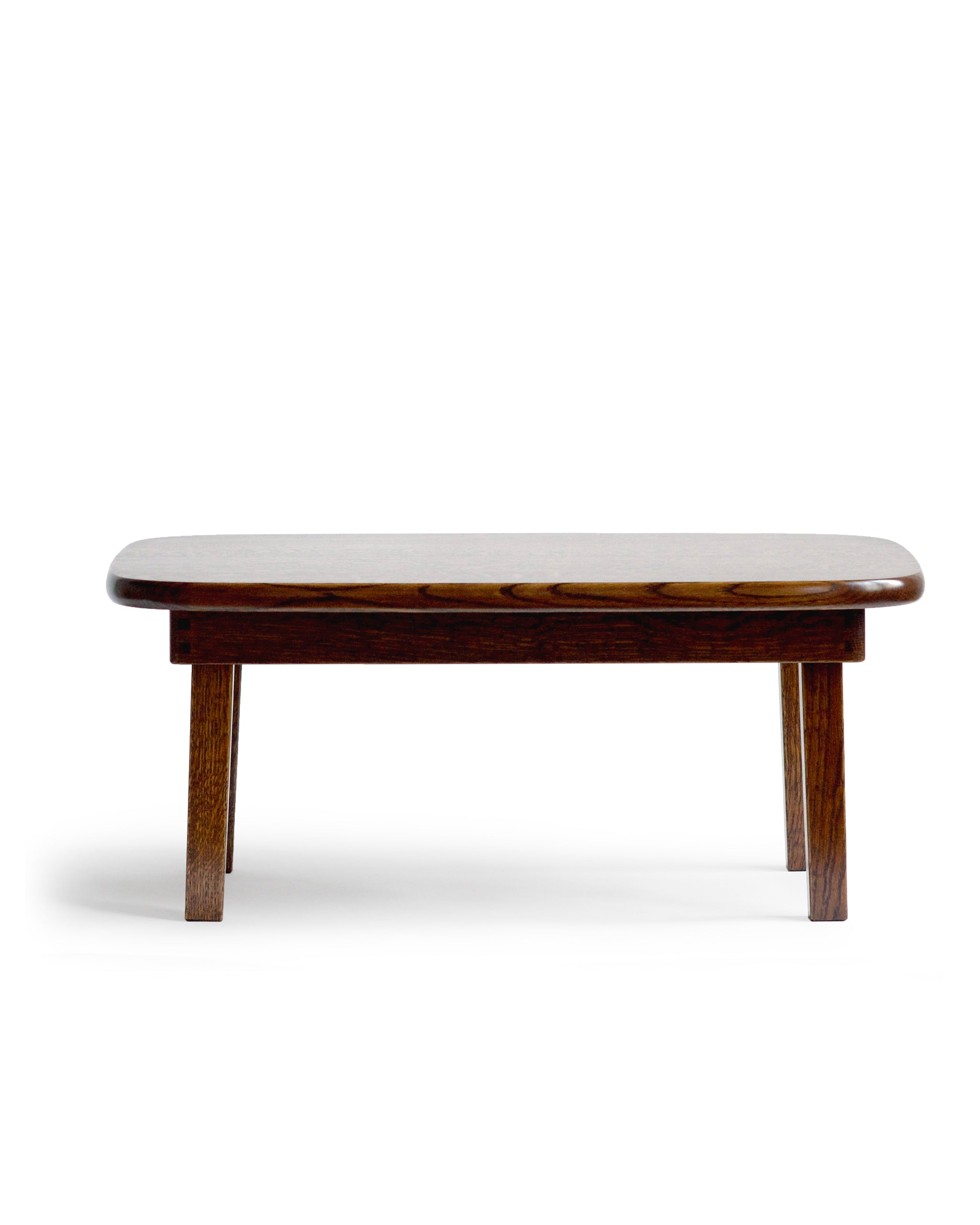 Straight front view of silhouetted chabudai table against white background.