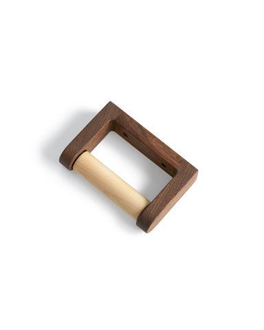 Walnut Wood toilet paper holder designed by Makoto Koizumi against white background