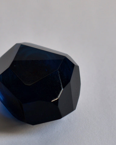 Cropped detail of the dark blue reclaimed blue jewelry cut paperweight. 