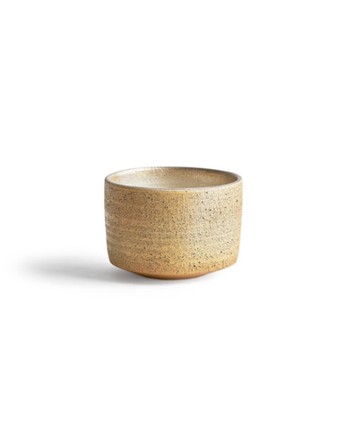 Silhouetted image of the uchugin silver matcha bowl against white background.