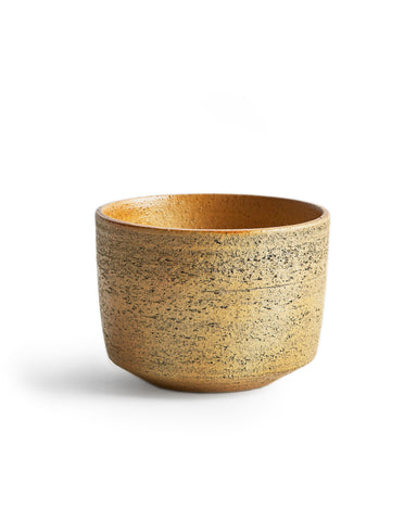 Silhouetted image of the otosai yellow matcha bowl against white background.